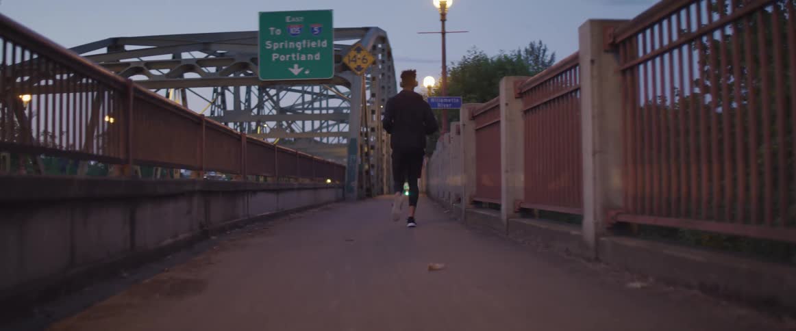 A person running on a sidewalk outside