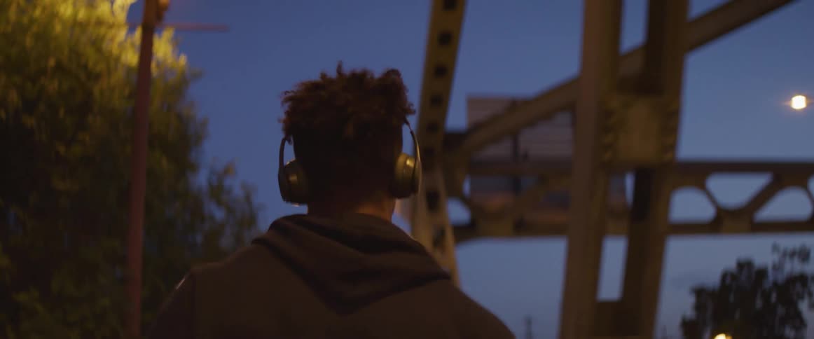 A man running outside a dusk
