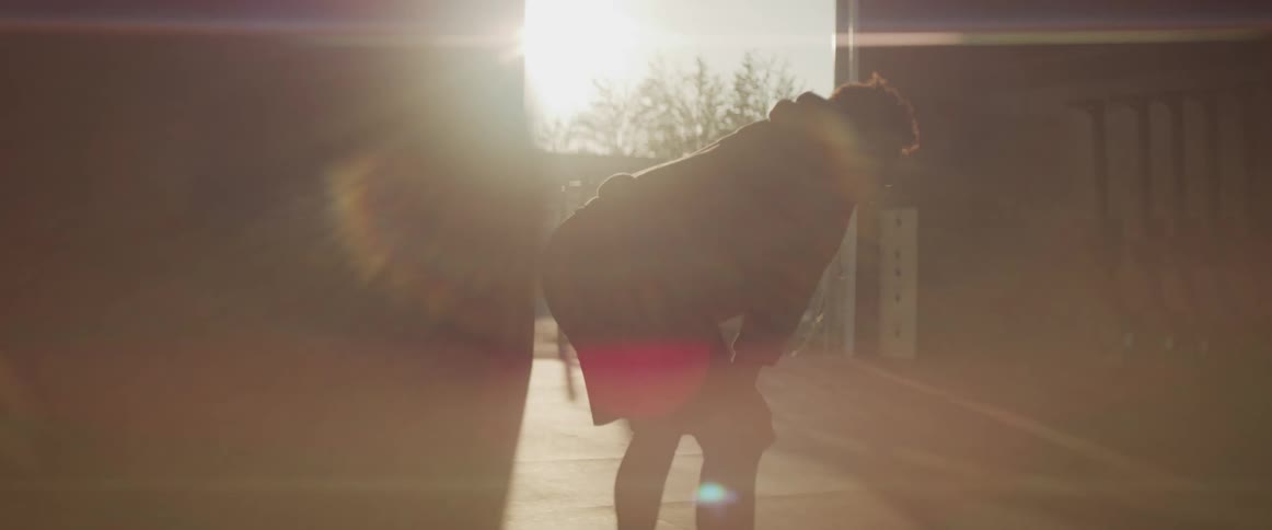 A teenage boy catches his breath after exercising