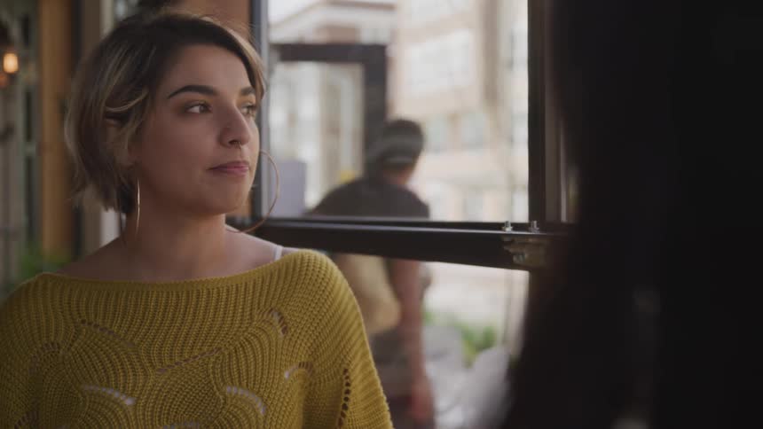 Two women talking in a cafe