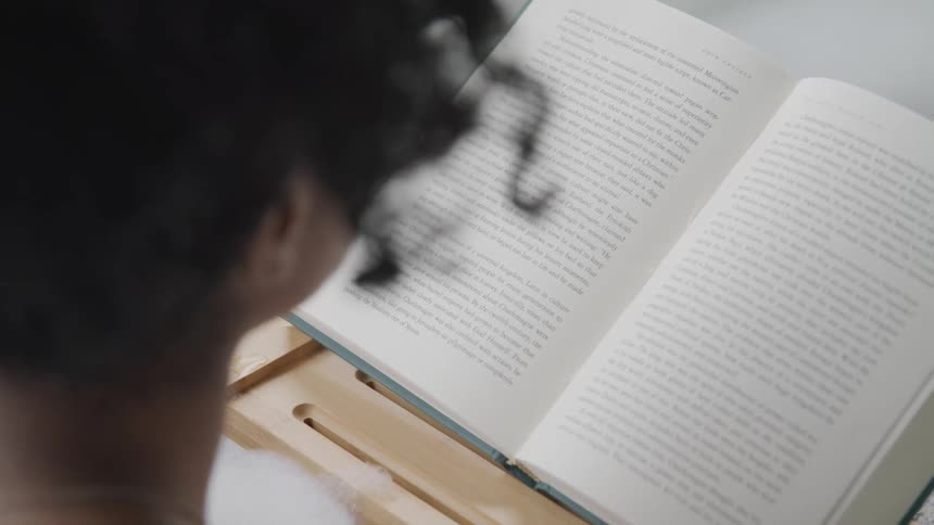 Reading a book while relaxing in a bubble bath