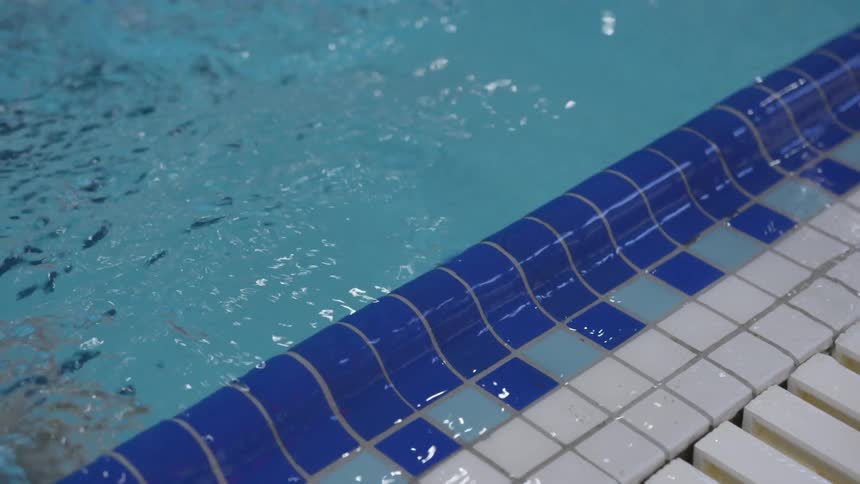 A person swimming in a pool
