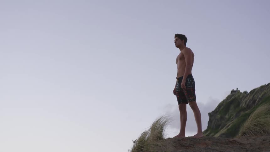 A man is standing on the cliff