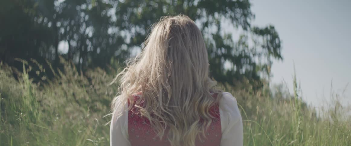 A woman standing in a field