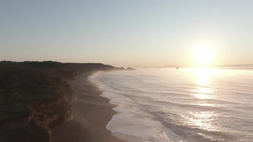 Aerial view of waves rolling in to the shore