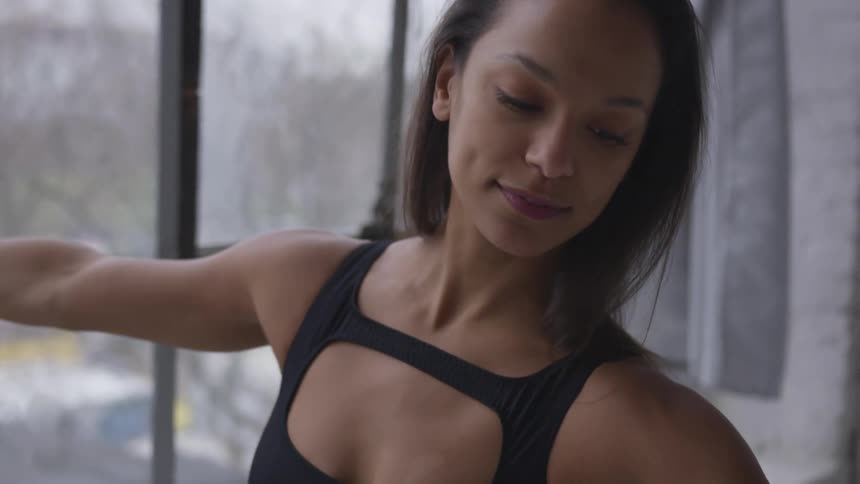 A black female dancing and posing