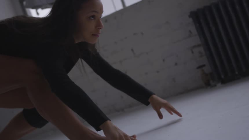 A woman dancing indoors