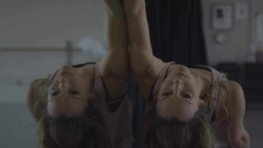 A young woman stretching at home