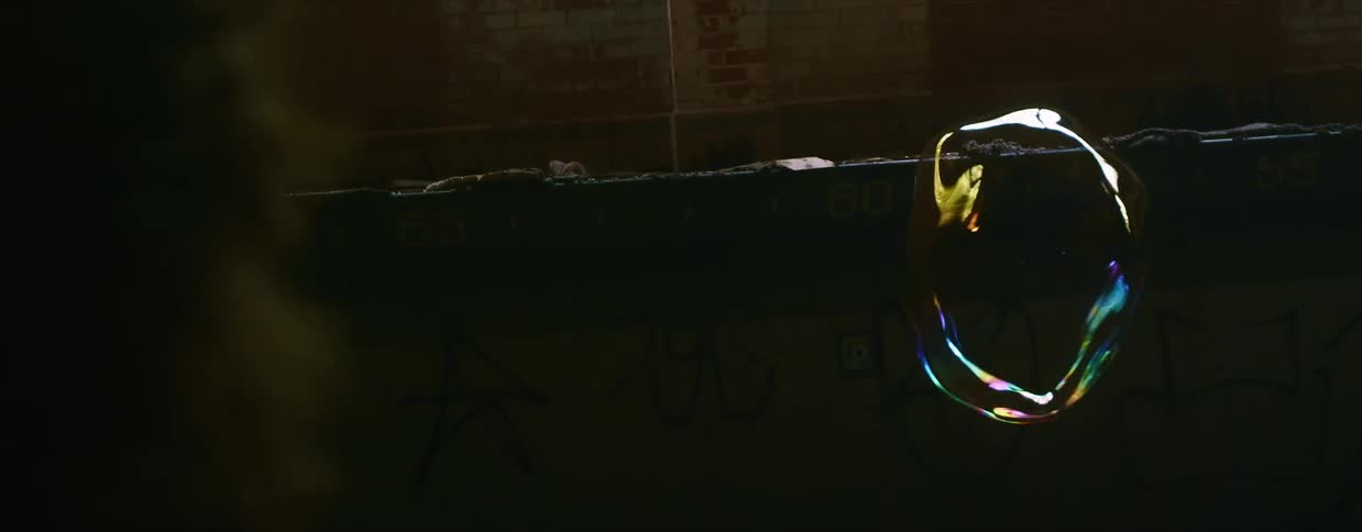 A large bubble floating inside a dark building