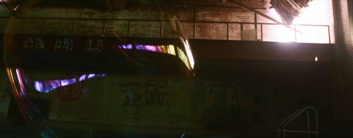 A large bubble floating through an abandoned building