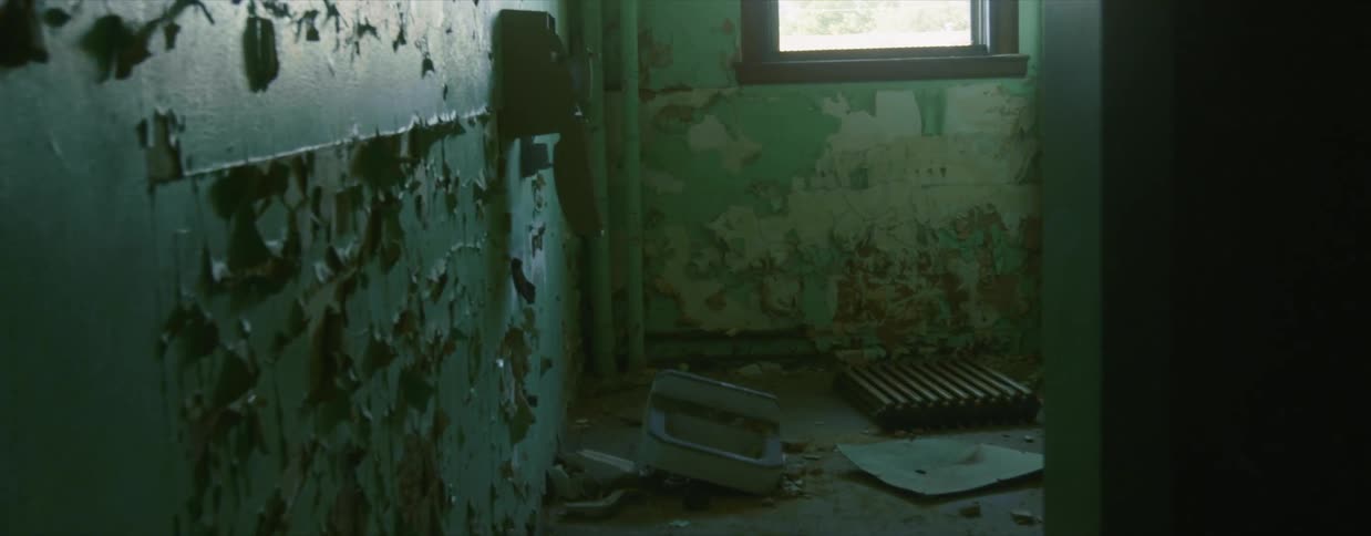 Debris on the floor of an abandoned and dilapidated building