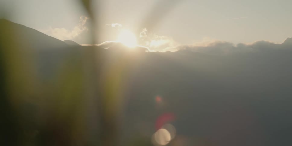 The sun is setting in the horizon