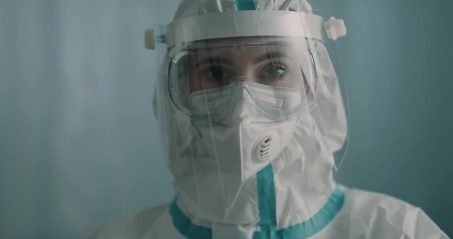 Female lab technician wearing a hazmat suit