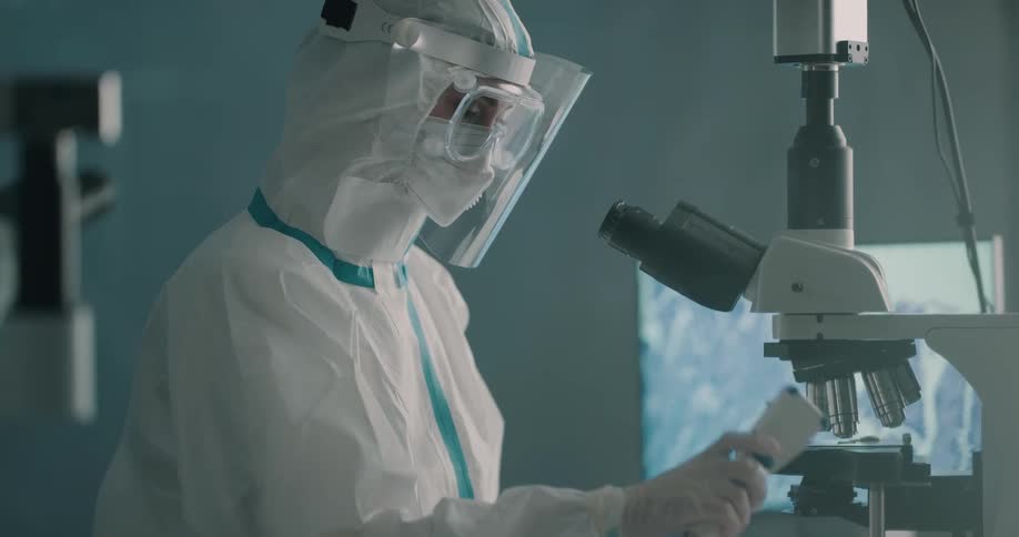 Lab technician handles samples on a laboratory