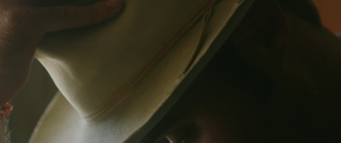 A man is wearing a hat indoors