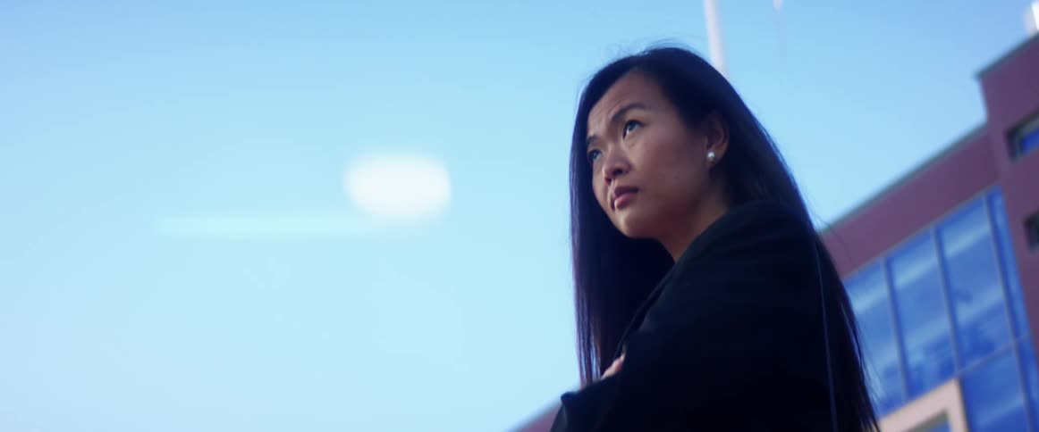 Young woman standing outside a building in the city