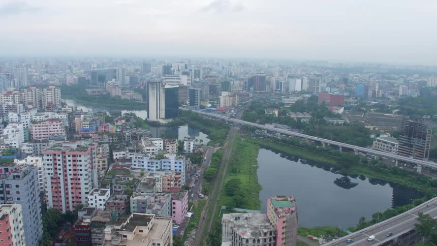 An aerial view of a downtown city in spring is displayed