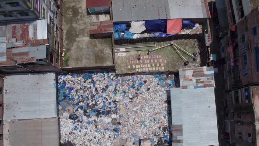 People are gathering garbage on the roof