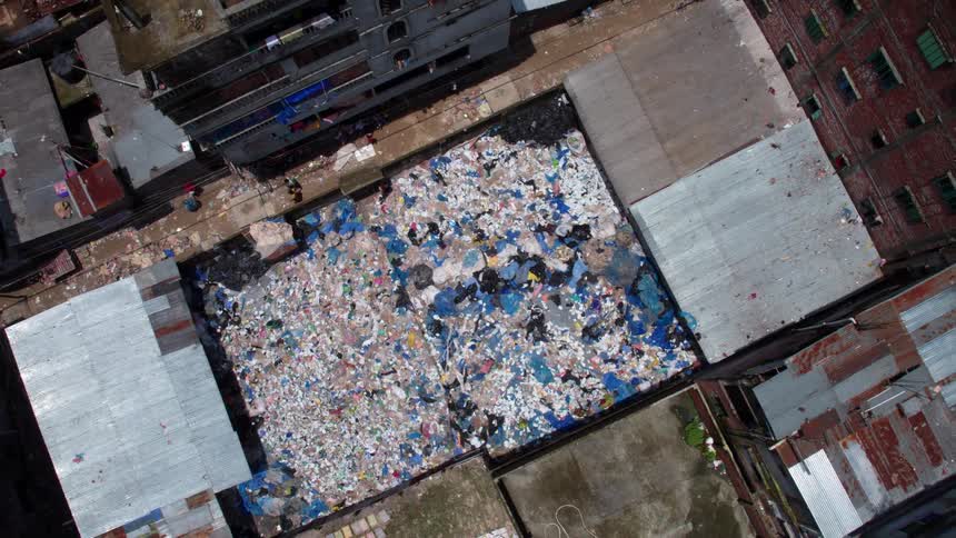 People are clearing garbage on the roof