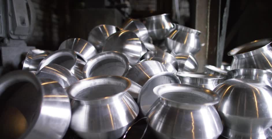 Steel pots sitting in a factory