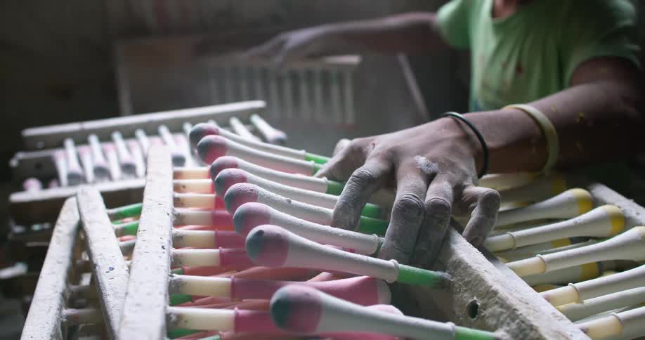A boy working on a third world country ballon factory