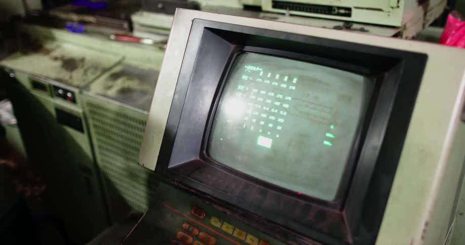 People push buttons on an old machine