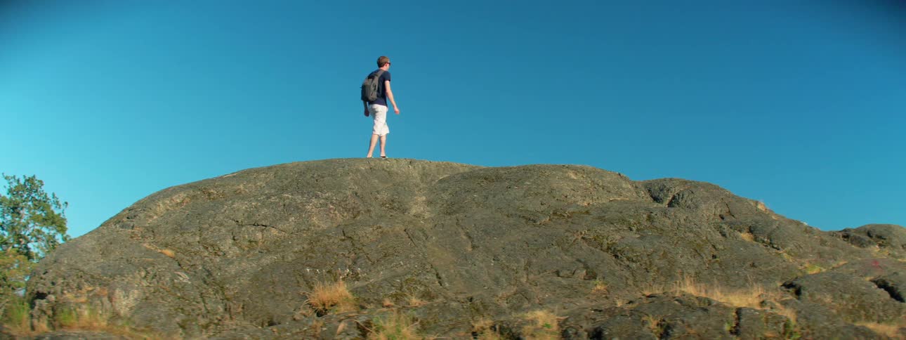 A man is hiking outdoors in spring