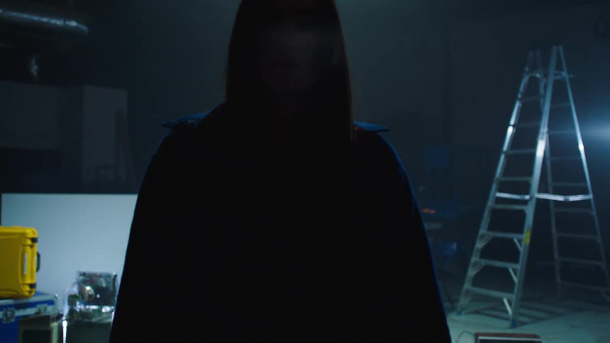 A woman walks off of a set