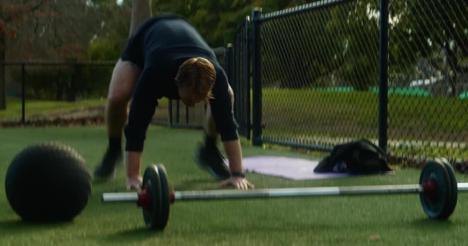 A man is exercising outdoors in spring