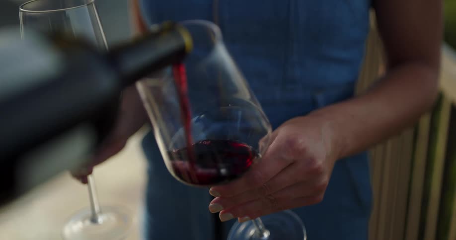 Red wine being poured into wine glass