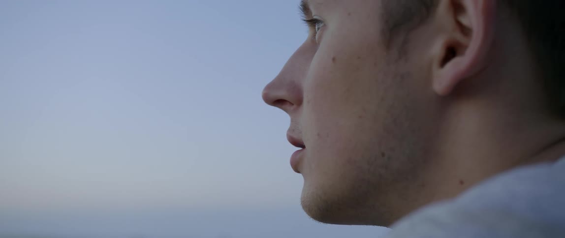 A man looks around during the day