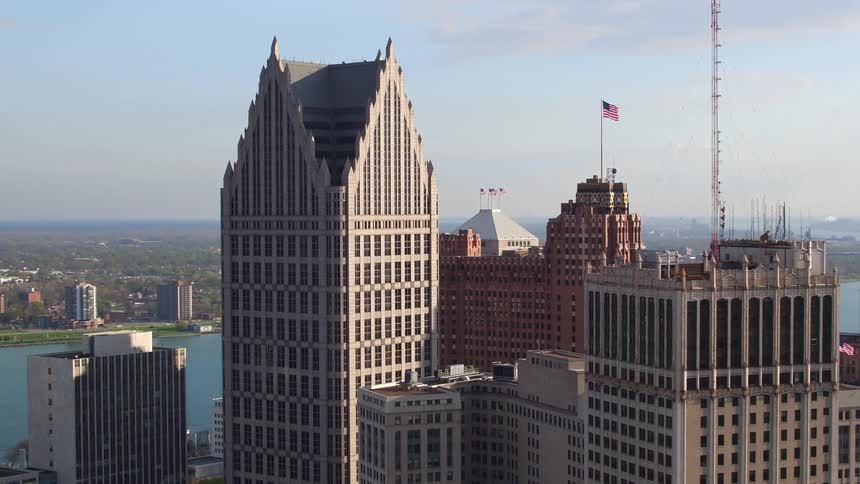 A city with buildings and skyscrapers with the sky and clouds in the background