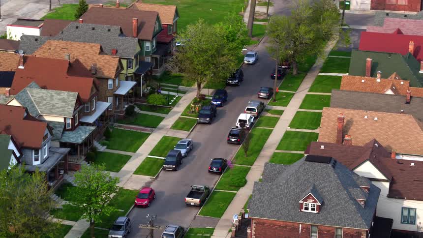 A street through a neighborhood in a city during the day