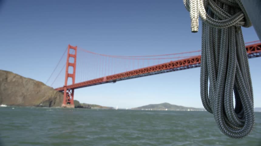 A bridge suspended over a water body near islands