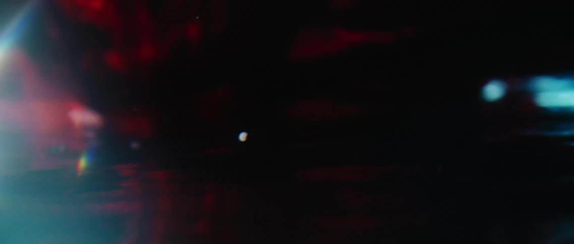 Dark red fabric floating beneath water