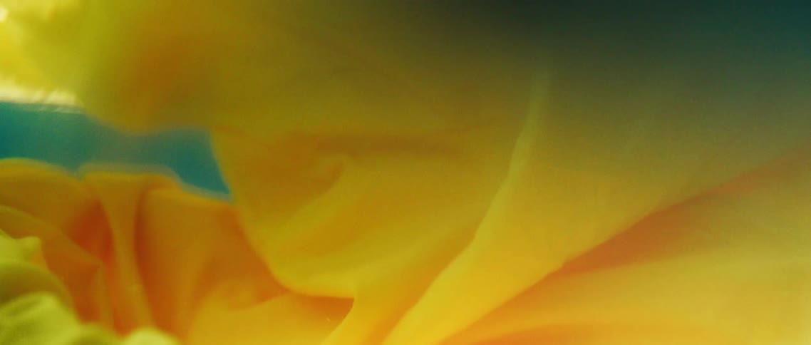 Yellow fabric flowing and billowing underwater