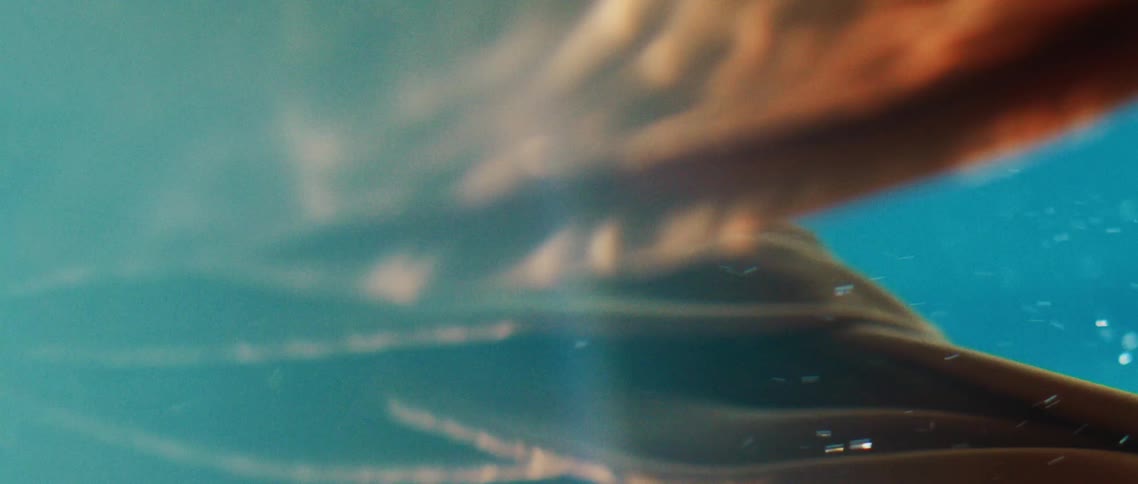 Orange fabric moving underwater