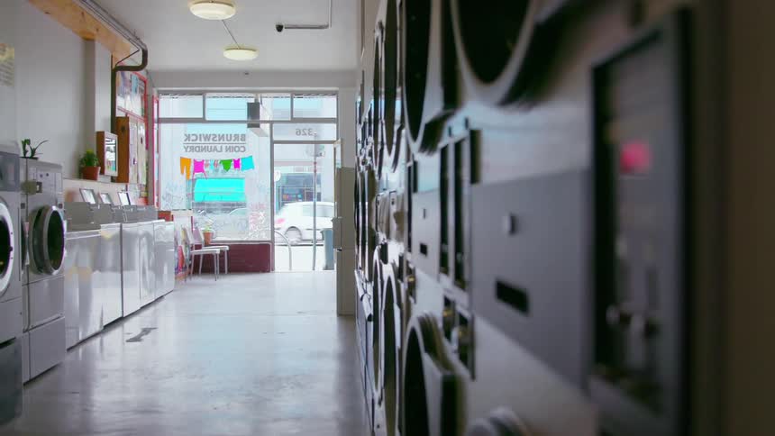 A laundromat devoid of people during the day