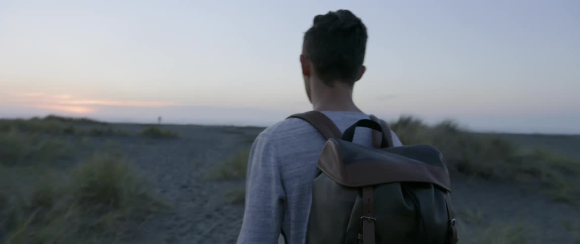 A man walking through a rural area