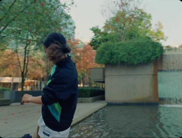 Three teens hanging out and dancing outside