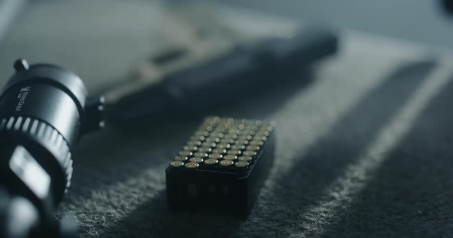 A woman picking up bullets
