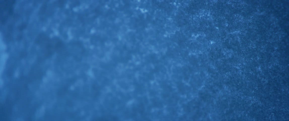 The window is covered with snow and frost