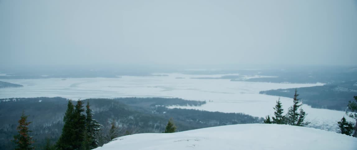 Overlooking a frozen expanse from the top of a mountain