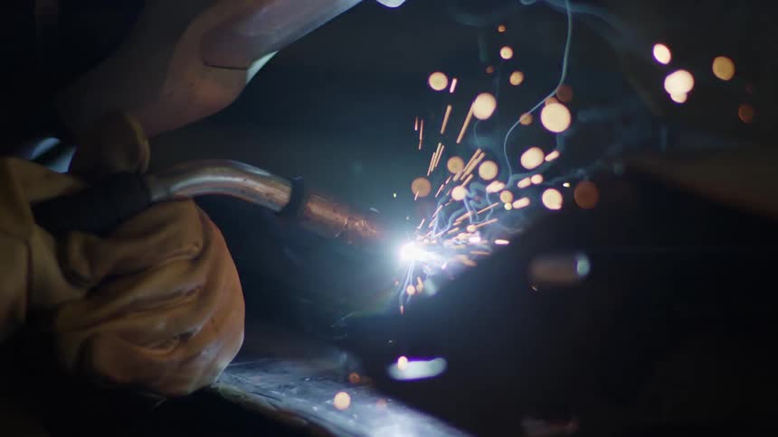 Sparks fly as a person welds