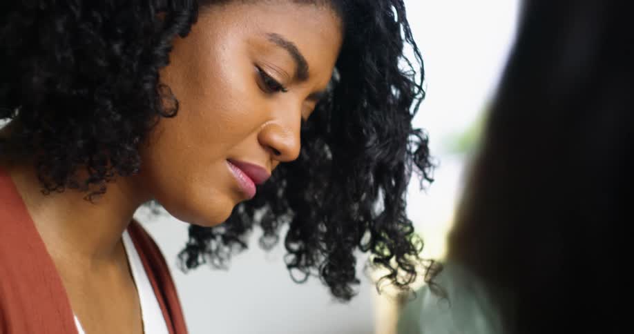 A woman is looking down at something