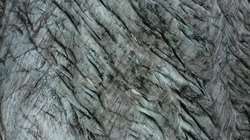 White textured surface with darker crevices