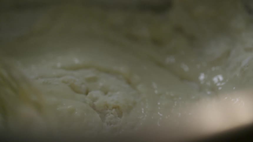 Someone mixing batter