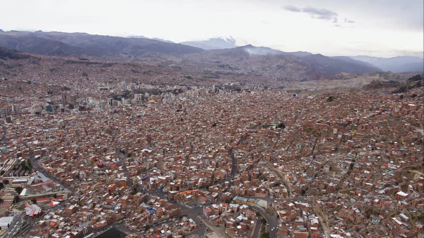 Camera is flying over a large city