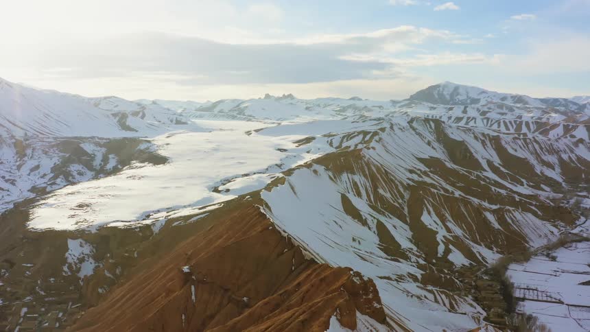 A snowy mountain ridge on a sunny day