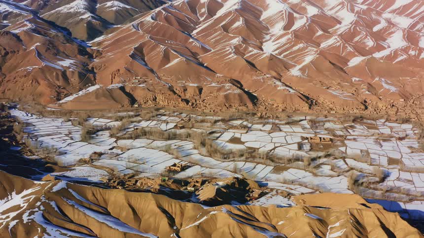 Aerial view of snow covered mountains
